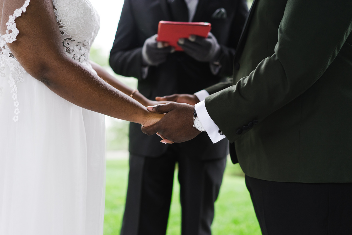 Bride and Groom Holding Hands at a Wedding 